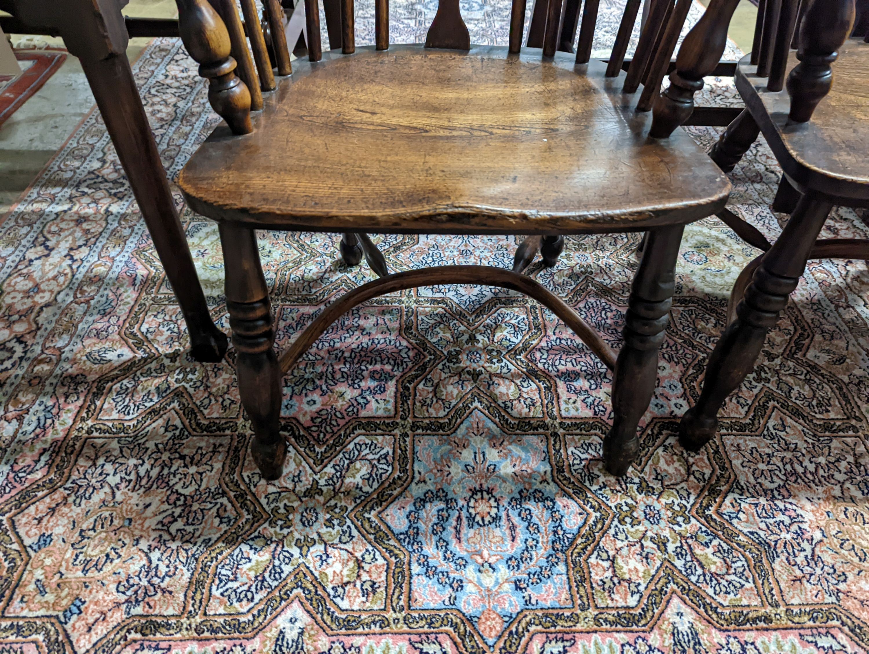 A pair of early 19th century ash and elm Windsor chairs. H-87cm.